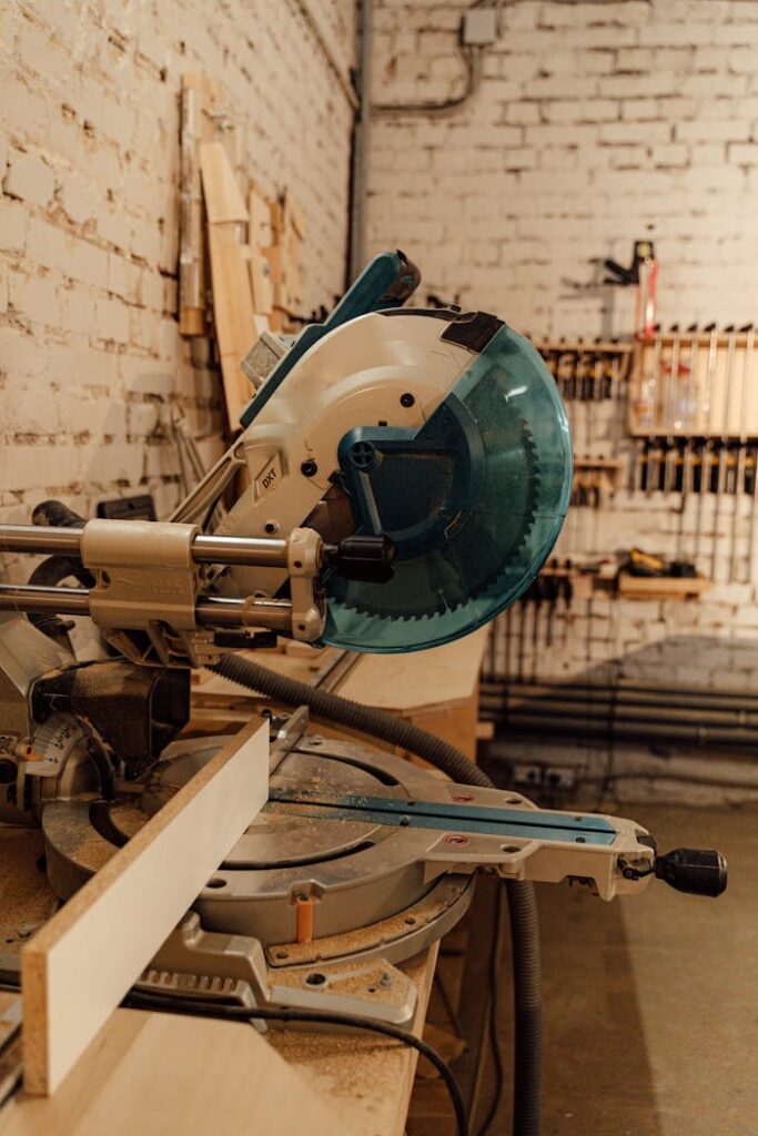 Close-up of an industrial grinder in a woodworking workshop, showcasing machinery and tools.